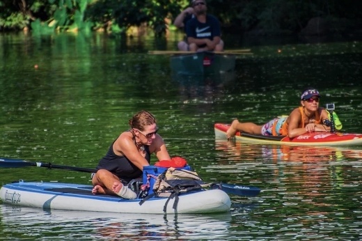 two people on paddleboards on clear creek
