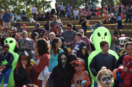 People in Halloween costumes such as aliens