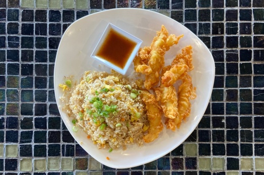 Chicken tenders and fried rice with sauce