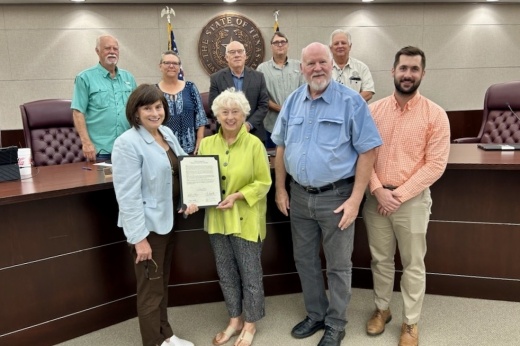 Adults holding a resolution.