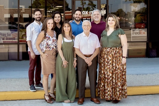 new owners standing in front of Box It