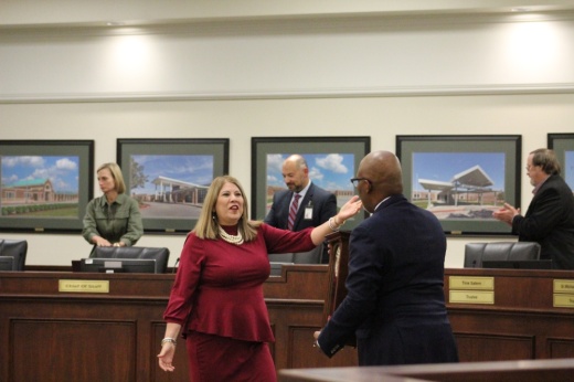 The photo shows TISD Superintendent Martha Salazar-Zamora being honored by Rodney Watson.