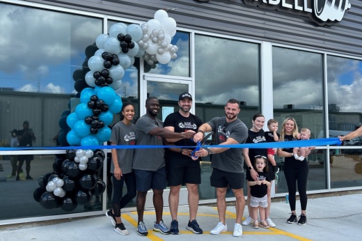 staff cutting ribbon