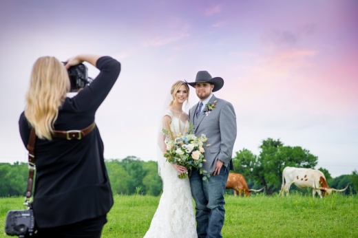 Kelly Blackall takes a wedding portrait photo.