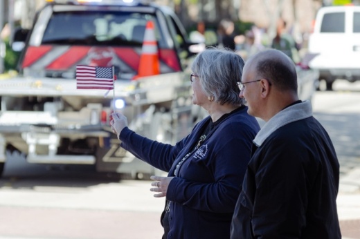 woman holding a flag during a parade