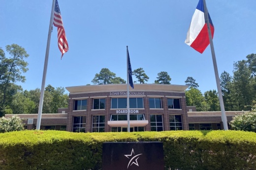 The United States and Texas Flag fly in front of the Lone Star College Board Room building.