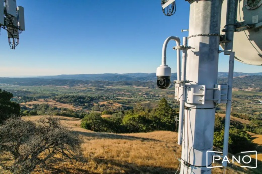 camera attached to a pole overlooking a field