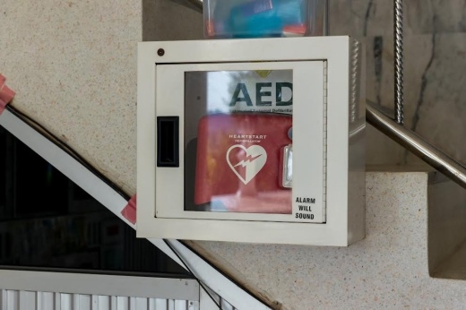 Automated external defibrillator unit on a wall