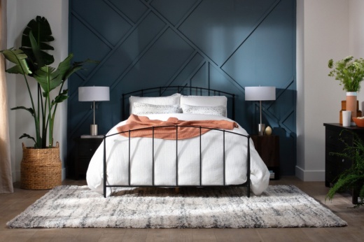 bedroom decor, including bed frame, sheet set, plants, rugs, dressers, nightstands, lamps and curtains