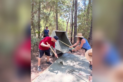 people pouring concrete