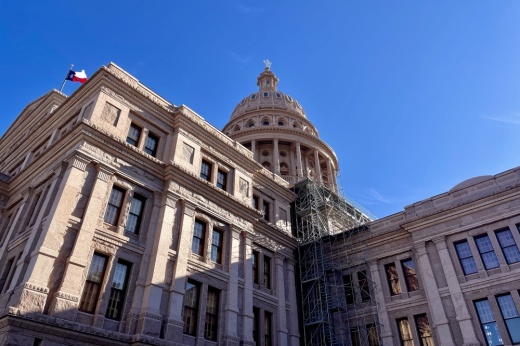 The Texas Capitol in front of a clear, blue sky.