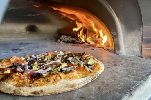Supreme pizza in wood fired oven