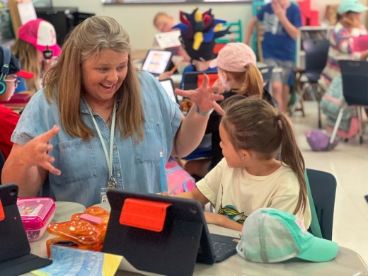 teacher instructing student with hand gestures