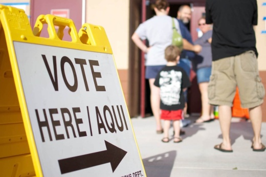Bilingual vote here sign