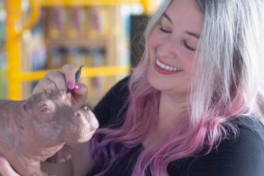 Elizabeth Bonura sculpting a hippo