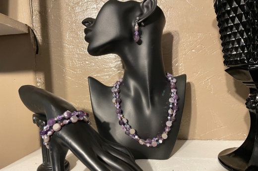 The photo shows jewelry from Kris10's Gems on a mannequin.