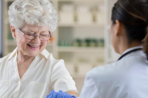 Senior patient gets flu vaccine