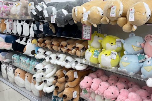 A shelf full of stuffed toys