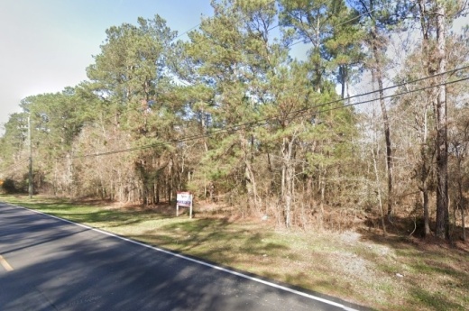 property along a road with trees