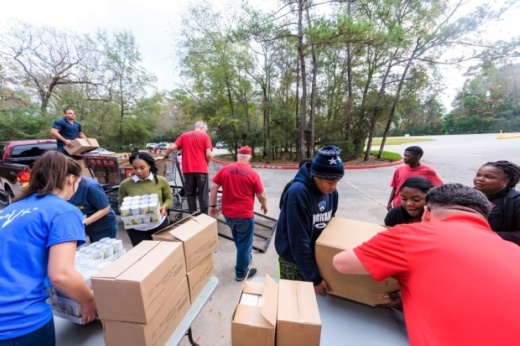Montgomery County Food Bank volunteers, pictured here in 2021, process donations for a food drive.