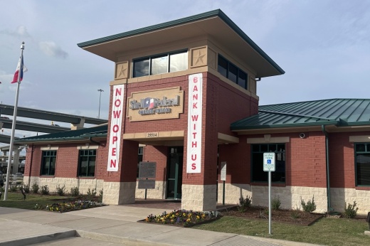 the brick exterior of a Shell Federal Credit Union with a sign that says Now Open and another that says Bank With Us