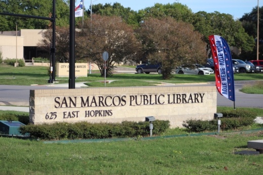 entrance sign to the San Marcos Public Library, an election polling location
