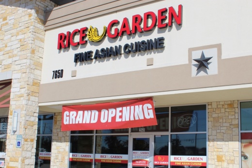 Rice Garden storefront with grand opening sign