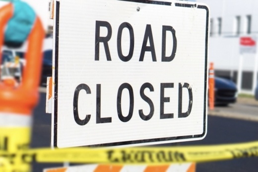 Picture of a road closed sign.