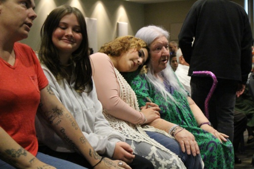 Parents and grandparents gathered to celebrate the official certification of adoption for their children.