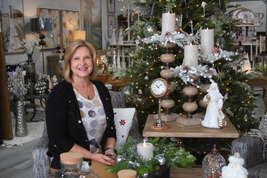 woman stands in a store by a display
