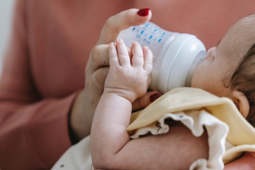 baby being fed a bottle