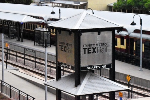 Trinity Metro TEXRail sign standing over train station in Grapevine