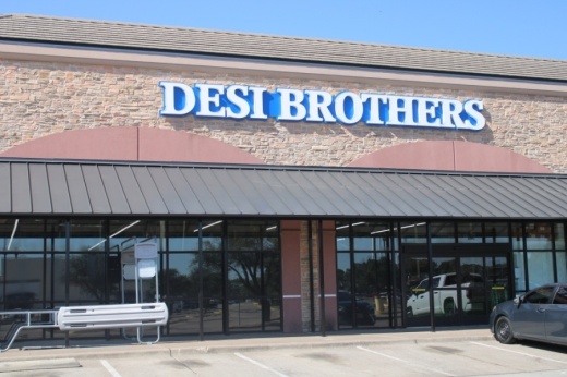 A shopping mail with a large sign above the location for the Indian grocer Desi Brothers.