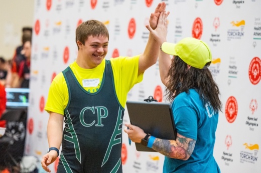 two people high-fiving each other