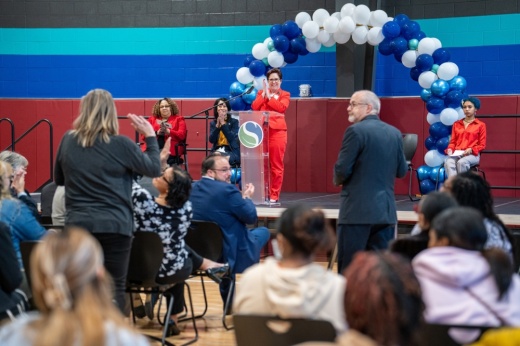 The photo shows MHS principal Stacy Smith speaking at the event.