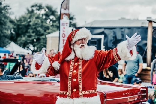 Santa waving during a parade