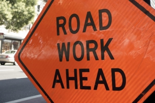 Picture of a road sign noting crews are working.