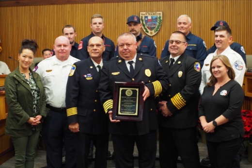 fire chiefs posing with a certificate