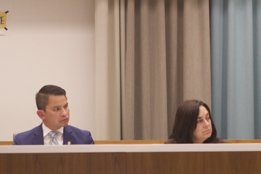 Interim Superintendent Matias Segura and District 5 board member Lynn Boswell sit at the dais at an Austin ISD board of trustees meeting.