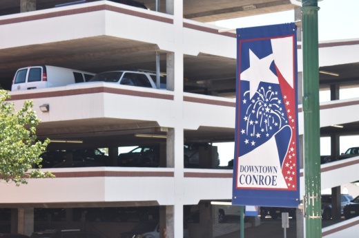 Downtown Conroe sign attached to a light pole