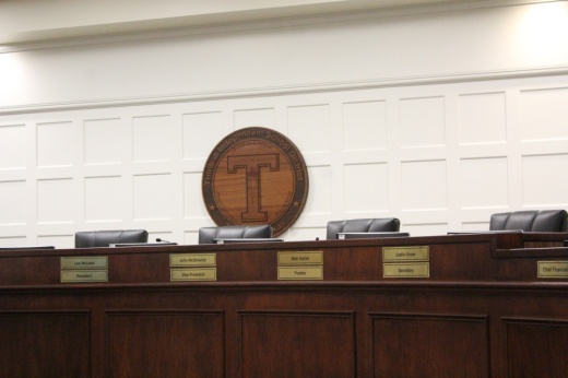 The photo shows TISD's board of trusees dias.