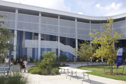 Students walk in the outdoor courtyard of Dr. General Marshall Middle School in Mueller.