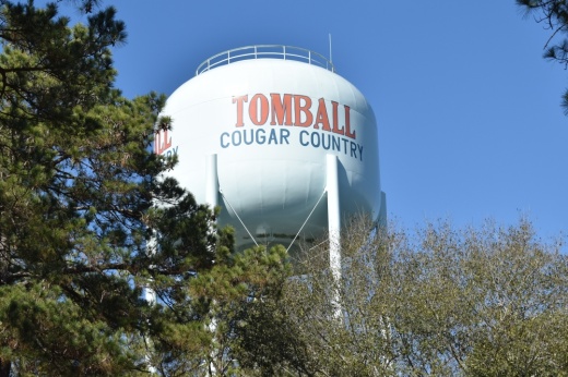 Water tower with trees visible in the foreground