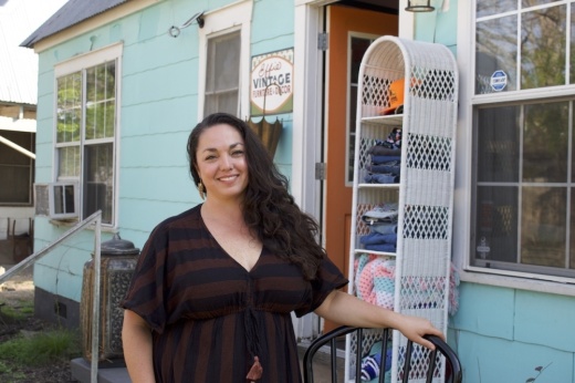 Woman poses in front of store