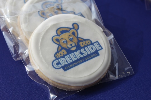 cookie with creekside elementary cub logo