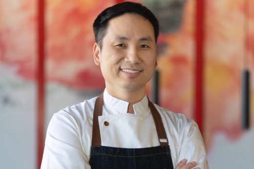 a portrait of Ho Chee Boon smiling in chef outfit