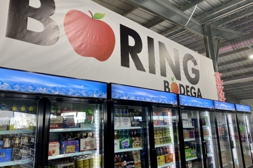 Fridges and a sign reading "Boring Bodega."
