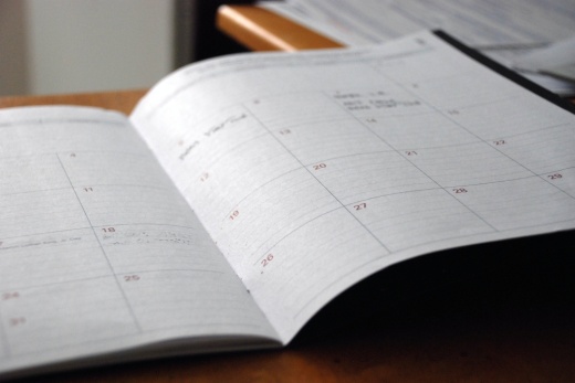 A close up shot of a calendar on a desk