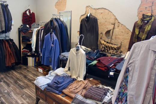 Mens clothing on racks and tables