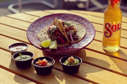 Tacos with salsa bowls